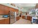 Updated kitchen, featuring stainless steel appliances and a large refrigerator at 7121 Victoria Cir, University Park, FL 34201