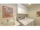 Convenient laundry room with washer, dryer and storage cabinets at 7121 Victoria Cir, University Park, FL 34201
