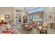 Living area showcasing floral sofas and a cozy atmosphere at 7121 Victoria Cir, University Park, FL 34201