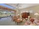 Living room with view of backyard patio and pond at 7121 Victoria Cir, University Park, FL 34201