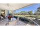 Enjoy the view from this screened porch with seating and pond views at 7121 Victoria Cir, University Park, FL 34201