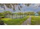 Well-maintained tennis courts with seating areas at 7121 Victoria Cir, University Park, FL 34201