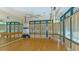 Yoga studio with hardwood floors and mirrors at 7121 Victoria Cir, University Park, FL 34201