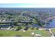 Aerial view of condo community near golf course and water at 7130 Fairway Bend Ln # 193, Sarasota, FL 34243