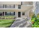 Condo building exterior with entrance and landscaping at 7130 Fairway Bend Ln # 193, Sarasota, FL 34243