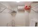 Spacious closet with wire shelving and hanging rods at 7130 Fairway Bend Ln # 193, Sarasota, FL 34243