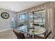 Charming dining area with glass table and chairs, offering a scenic view at 7130 Fairway Bend Ln # 193, Sarasota, FL 34243