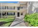 Condo building exterior with walkway and landscaping at 7130 Fairway Bend Ln # 193, Sarasota, FL 34243