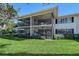 Two-story condo building with a lush green lawn at 7130 Fairway Bend Ln # 193, Sarasota, FL 34243