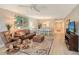 Spacious living area with leather furniture and a dining area at 7130 Fairway Bend Ln # 193, Sarasota, FL 34243