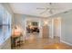 Home office with built in dresser, desk and view into the living room at 7130 Fairway Bend Ln # 193, Sarasota, FL 34243