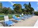 Relaxing pool deck with lounge chairs and patio furniture at 7130 Fairway Bend Ln # 193, Sarasota, FL 34243