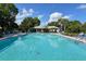 Relaxing community pool with plenty of lounge chairs at 7130 Fairway Bend Ln # 193, Sarasota, FL 34243