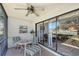 Peaceful screened patio with table and chairs, overlooking a tranquil view at 7130 Fairway Bend Ln # 193, Sarasota, FL 34243