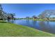 Serene waterfront view with lush landscaping and golf course at 7130 Fairway Bend Ln # 193, Sarasota, FL 34243