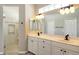 Bathroom with double vanity, glass shower, and neutral tile at 7160 Rue De Palisades # 4, Sarasota, FL 34238