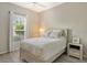 Cozy bedroom with a comfortable bed and plenty of natural light at 7160 Rue De Palisades # 4, Sarasota, FL 34238