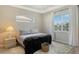 Spacious bedroom with large window and neutral decor at 7160 Rue De Palisades # 4, Sarasota, FL 34238