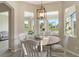 Kitchen breakfast nook with wooden table and chairs at 7160 Rue De Palisades # 4, Sarasota, FL 34238