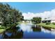 Tranquil lakefront community with lush landscaping and fountains at 7160 Rue De Palisades # 4, Sarasota, FL 34238