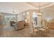 Open concept dining room with a glass table and view of the living room at 7160 Rue De Palisades # 4, Sarasota, FL 34238