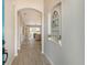 Bright and airy entryway with wood-look floors and a view into the living room at 7160 Rue De Palisades # 4, Sarasota, FL 34238