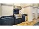Stainless steel grill with granite countertops and dark cabinets at 7160 Rue De Palisades # 4, Sarasota, FL 34238