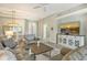 Open living area showcasing a large TV and stylish furnishings at 7160 Rue De Palisades # 4, Sarasota, FL 34238