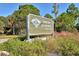 Entrance to Oscar Scherer State Park, showcasing park signage at 7160 Rue De Palisades # 4, Sarasota, FL 34238
