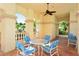 Covered patio with table and chairs, perfect for outdoor dining at 7160 Rue De Palisades # 4, Sarasota, FL 34238