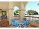 Patio furniture with blue striped cushions near pool at 7160 Rue De Palisades # 4, Sarasota, FL 34238