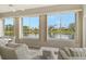 Sunroom boasting stunning lake views and ample natural light at 7160 Rue De Palisades # 4, Sarasota, FL 34238