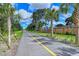 Paved trail lined with palm trees, ideal for walking or cycling at 7160 Rue De Palisades # 4, Sarasota, FL 34238