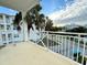 Spacious balcony with scenic views of the community and palm trees at 7740 34Th W Ave # 203, Bradenton, FL 34209