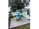 Deck with table, chairs, and hammock, perfect for outdoor entertaining at 935 Rhodes Ave, Sarasota, FL 34237