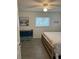 Bedroom with king-size bed, dresser, and beach-themed decor at 935 Rhodes Ave, Sarasota, FL 34237