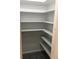 Well-lit pantry with ample shelving, granite countertops at 935 Rhodes Ave, Sarasota, FL 34237