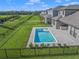Aerial view of a home with a private pool and fenced backyard at 9511 Tequila Sunrise Dr, Sarasota, FL 34241