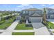 Two-story house with two-car garage, landscaping, and driveway at 9511 Tequila Sunrise Dr, Sarasota, FL 34241