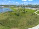 Aerial view of a residential lot near a lake at 9511 Tequila Sunrise Dr, Sarasota, FL 34241