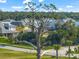 Aerial view of a bird perched on a tree overlooking homes at 9511 Tequila Sunrise Dr, Sarasota, FL 34241
