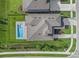 Aerial view showcasing home's layout and pool at 9511 Tequila Sunrise Dr, Sarasota, FL 34241