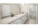 Bathroom with double vanity and beige countertop at 9511 Tequila Sunrise Dr, Sarasota, FL 34241