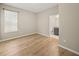 Bright bedroom with hardwood floors and en-suite bathroom at 9511 Tequila Sunrise Dr, Sarasota, FL 34241