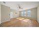 Bright bedroom with hardwood floors and ceiling fan at 9511 Tequila Sunrise Dr, Sarasota, FL 34241