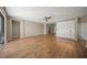 Spacious bonus room featuring hardwood floors and built-in cabinets at 9511 Tequila Sunrise Dr, Sarasota, FL 34241