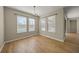 Bright dining room with hardwood floors and pool view at 9511 Tequila Sunrise Dr, Sarasota, FL 34241
