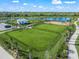 Community dog park with fenced-in areas and a shaded pavilion at 9511 Tequila Sunrise Dr, Sarasota, FL 34241