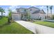 Two-story home with two-car garage and landscaping at 9511 Tequila Sunrise Dr, Sarasota, FL 34241