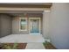 Modern front entrance with a blue door at 9511 Tequila Sunrise Dr, Sarasota, FL 34241